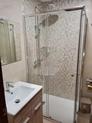 a bathroom with a shower and a sink at Casa San Miguel in Chantada