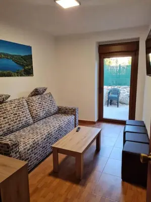 a living room with a couch and a coffee table at Casa San Miguel in Chantada