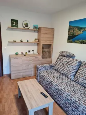 a living room with a couch and a coffee table at Casa San Miguel in Chantada