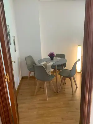 a dining room with a table and chairs at A Casa do Sastre 2 in Ribadavia