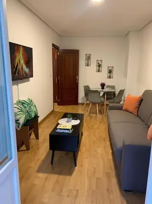 a living room with a couch and a coffee table at A Casa do Sastre 2 in Ribadavia
