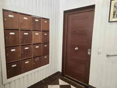 a room with wooden lockers and a door at Lugo Apartamento nuevo en centro de la ciudad in Lugo