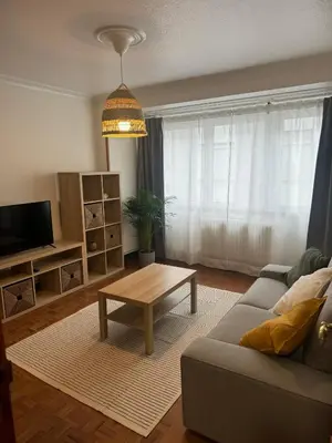 a living room with a couch and a coffee table at As Travesas II in Betanzos
