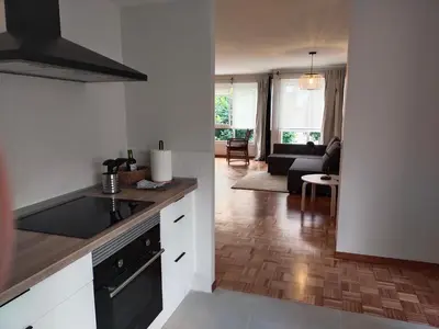 a kitchen and living room with a stove top oven at Fonteculler in Fonte Culler