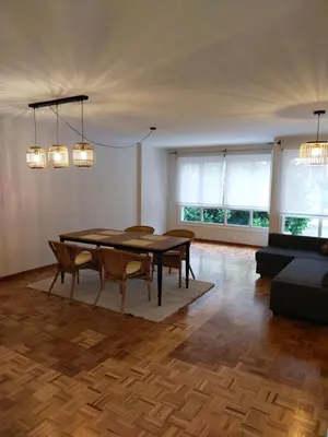 a dining room with a table and a couch at Fonteculler in Fonte Culler