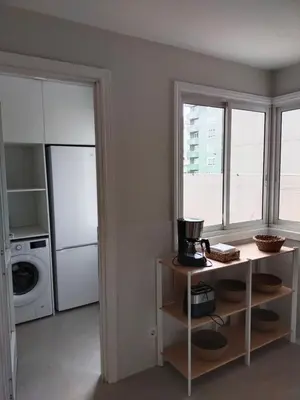 a kitchen with a washer and dryer at Fonteculler in Fonte Culler