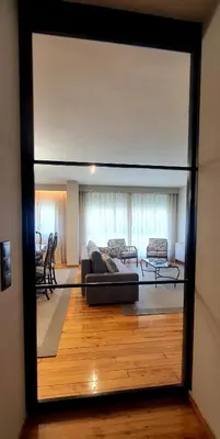 a view of a living room through a glass window at Marujarural in Sober