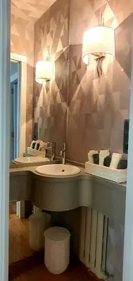 a bathroom with a sink and two lights above it at Marujarural in Sober