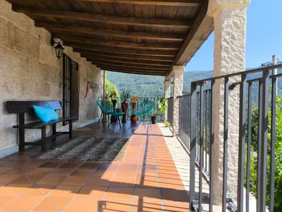 a balcony with a view of the mountains at Xiravai-Ribeira Sacra in Peares