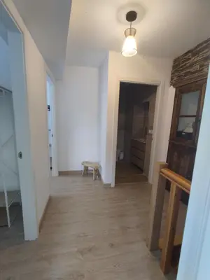 a room with a hallway with a table and a lamp at Casa Sáner in Rábade