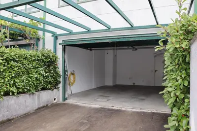 an open garage with a guitar inside of it at Mártires de Carral in Santa María