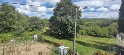 a view from the balcony of a house with a street light at Casa do Outeiro de Aguil in Castro Caldelas
