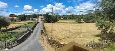 an empty road in a field with at Casa do Outeiro de Aguil in Castro Caldelas