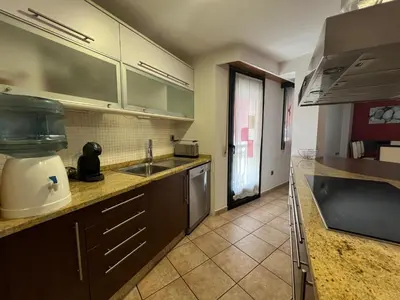 a kitchen with a sink and a counter top at YourHouse Aldo in Ourense