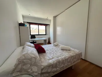 a bedroom with a bed and a desk at YourHouse Aldo in Ourense