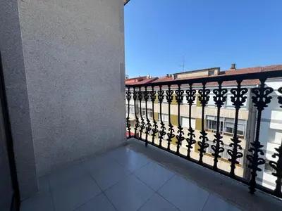 a balcony with a view of a building at YourHouse Aldo in Ourense