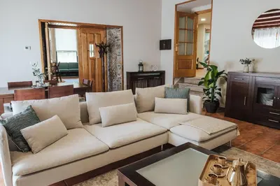 a living room with a couch and a table at Casa Rouco in Melide