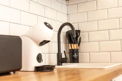 a kitchen counter with a kitchen sink with a faucet at Soños de Compostela in Santiago de Compostela