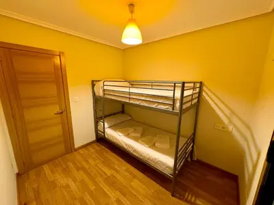 a small room with two bunk beds in it at Apartamento Herosa 1 Spa in Barreiros