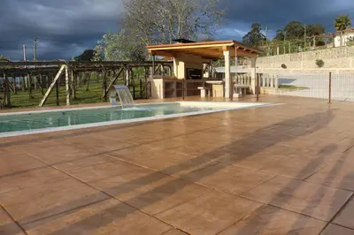 a swimming pool with a pavilion in a park at A de Jose Luis in Reis