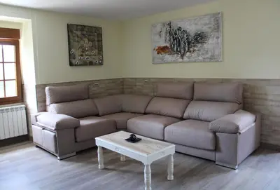 a living room with a couch and a coffee table at A de Jose Luis in Reis
