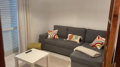 a living room with a couch and a table at Monte Faro El corazón de Galicia in Lalín