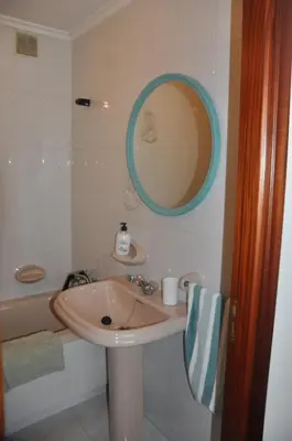 a bathroom with a sink and a tub and a mirror at Monte Faro El corazón de Galicia in Lalín