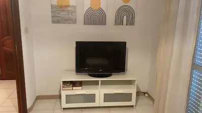 a flat screen tv sitting on top of a tv stand at Monte Faro El corazón de Galicia in Lalín