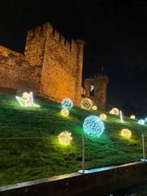 a castle with christmas lights in front of it at Castillo Buenavista in Ponferrada