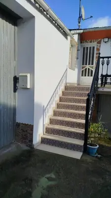 a set of stairs in front of a house at Casa Marcelino in Reinante