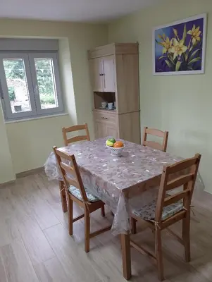 a dining room table with a bowl of fruit on it at Casa Marcelino in Reinante