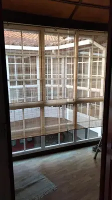 a view of a room with a large window at A Casa do Buxo in Casardeita