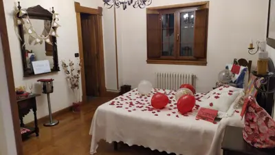 a room with a bed with red apples on it at El Urogallo in Noceda