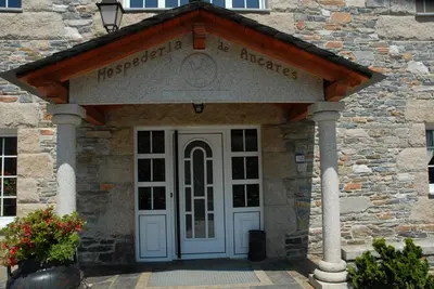 a entrance to a building with a white door at El Urogallo in Noceda