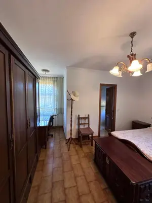 a bedroom with a bed and a table and a chair at Casa Lugar de Fidalgo in Vilamor
