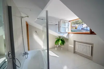 a bathroom with a shower and a sink at Hostal El Palacio in Molinaseca