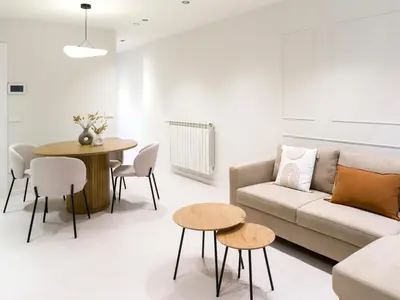 a living room with a couch and a table at Loft América 32-0 in Melide