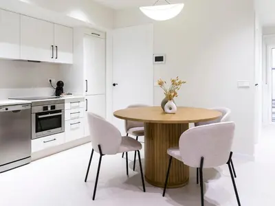 a kitchen with a wooden table and chairs at Loft América 32-0 in Melide