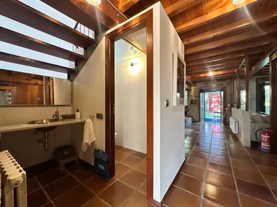 a bathroom with a shower and a sink in a room at Casa do Bidueiro in Luou