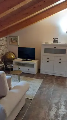 a living room with a couch and a table at O Lar Do Bispo in Arbo