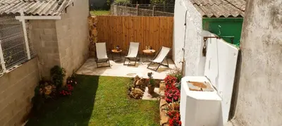 an aerial view of a backyard with a table and chairs at Casita con jardin en Sada in San Andrés de Carnoedo