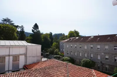 an overhead view of buildings and roofs at O Ferrador in Caldas de Reis