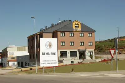a building with a sign on the side of a street at Hostal Tio Pepe II in Bembibre