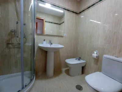a bathroom with a sink and a toilet and a shower at Monforte in Monforte de Lemos