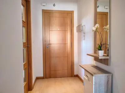 a hallway with a wooden door in a room at Monforte in Monforte de Lemos