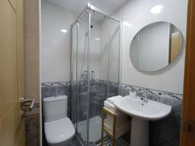 a bathroom with a shower and a toilet and a sink at Monforte in Monforte de Lemos