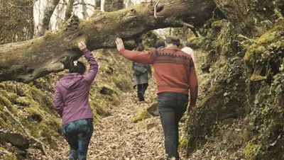 a group of people walking down a trail at Geodesic Domes with Best Views in Ribeira Sacra in Pincelo