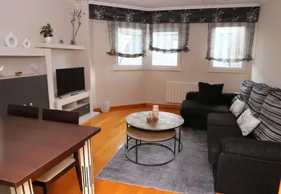 a living room with a couch and a table at Arel Dúplex in Lugo