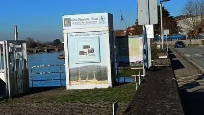 a sign for a bus stop next to a river at Cesuresrooms1 in Puentecesures