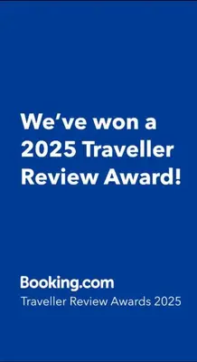 a blue sign that says weve won a traveler review award at Cesuresrooms1 in Puentecesures